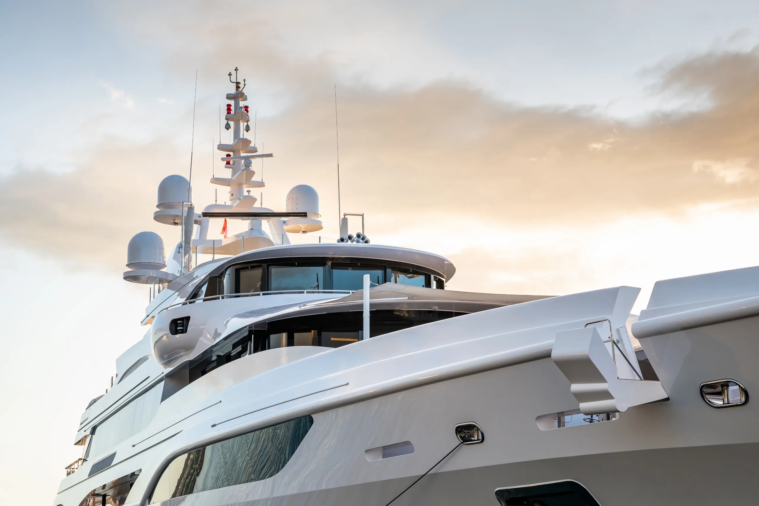 Motor yacht underway at sunset